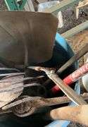 Plastic barrel containing handle tools-hoes,shovels, rakes,brooms, pry bar