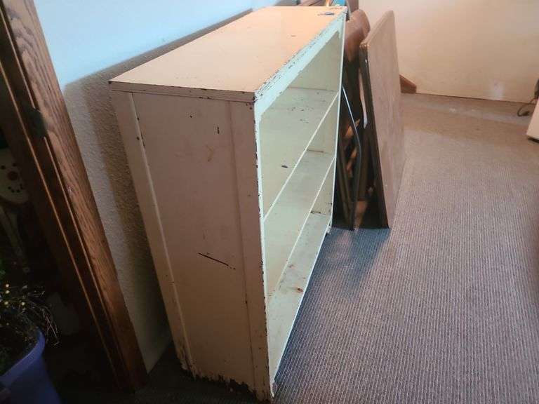 Vintage painted wooden bookshelf.