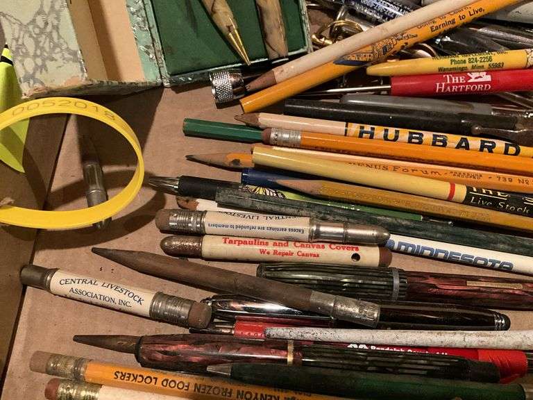 Large assortment of pencil and pens with advertisi