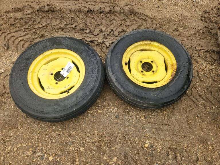 Pair of 6.70-15 Tires on 4 Bolt Rims