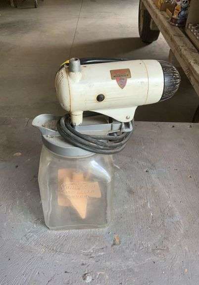 Vintage Sunbeam Automatic mix-master hand mixer on butter churn