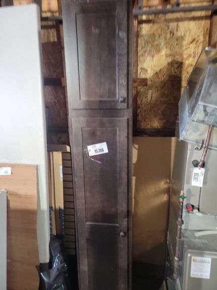 Wooden two door cabinet, 7+’ tall - located garage