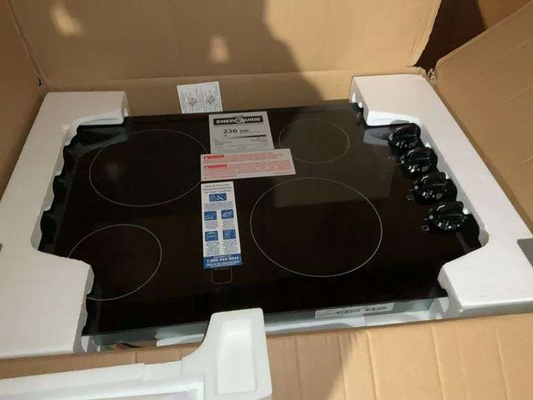 New Frigidaire flat glass range top – located garage