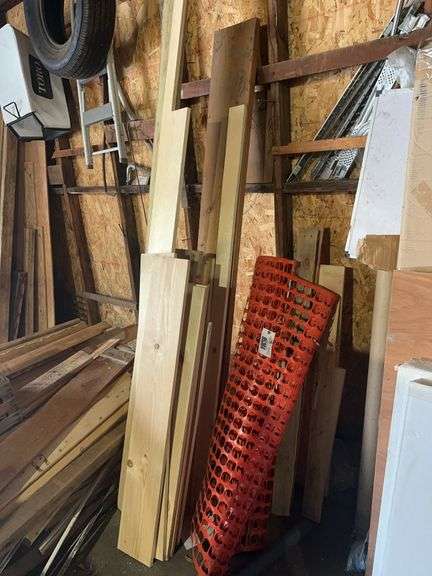 Plastic snow fence, lumber – located garage