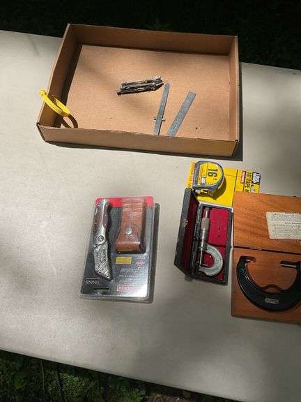 Flat of micrometers, tape measure, utility knife