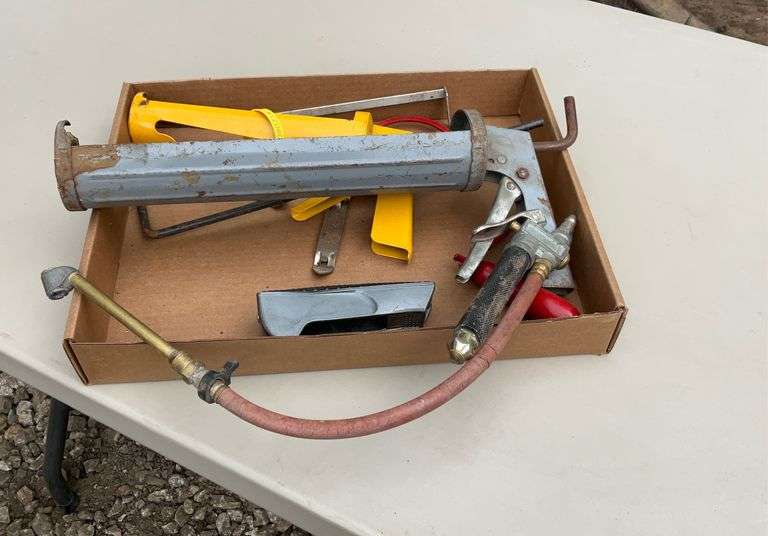 Flat with caulk guns, air chuck, hand saw