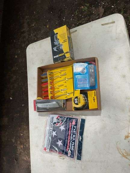 Flat with American Flag, work zone table vice, office stapler, screwdrivers