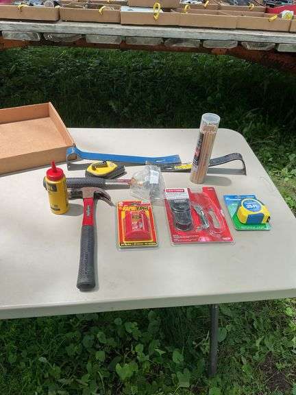 Flat of hammers, bars, tape measures, utility knives, chalk line