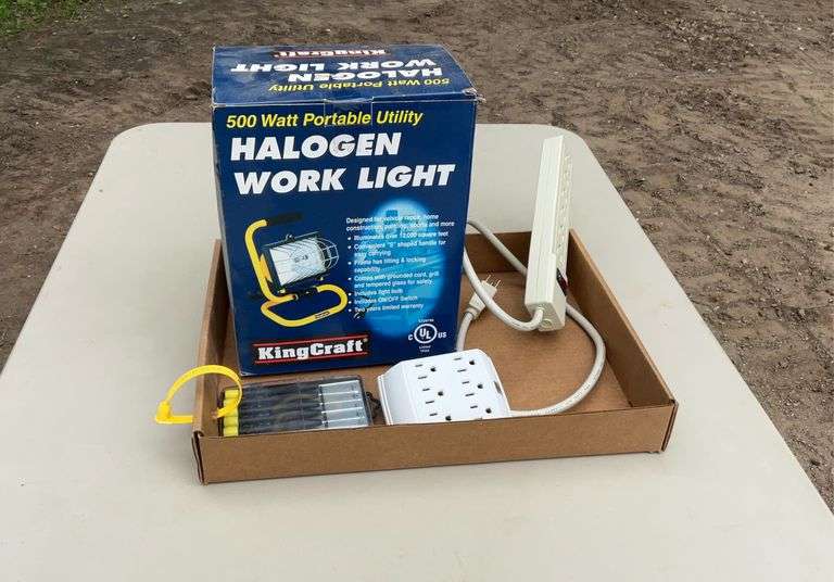 Flat of halogen work light, power strip, misc
