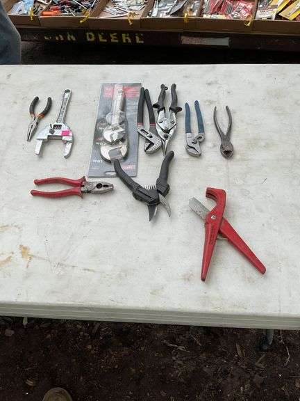 Flat of tin snips, pipe cutter, slip & lock nut wrench