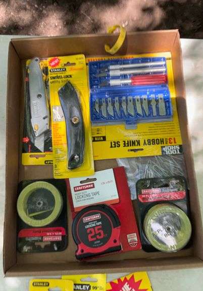 Flat of tape measures & utility knives