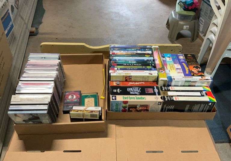 2 flats of cd's, cassettes music and VHS Tapes