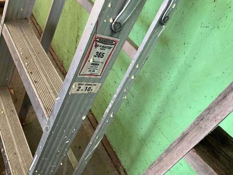 Aluminum step ladder and wood ladder