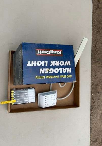 Flat of halogen work light, power strip, misc
