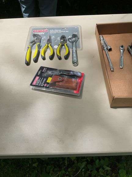 Flat of craftsman ratchets, utility knife, pliers