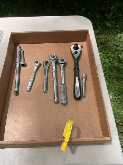 Flat of craftsman ratchets, utility knife, pliers