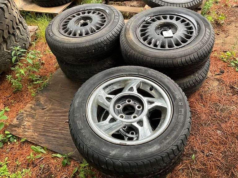 (4) 205/70r15 Tires on 5 Bolt Rims, (2) 215/55r16 Tires on 5 Bolt Rims