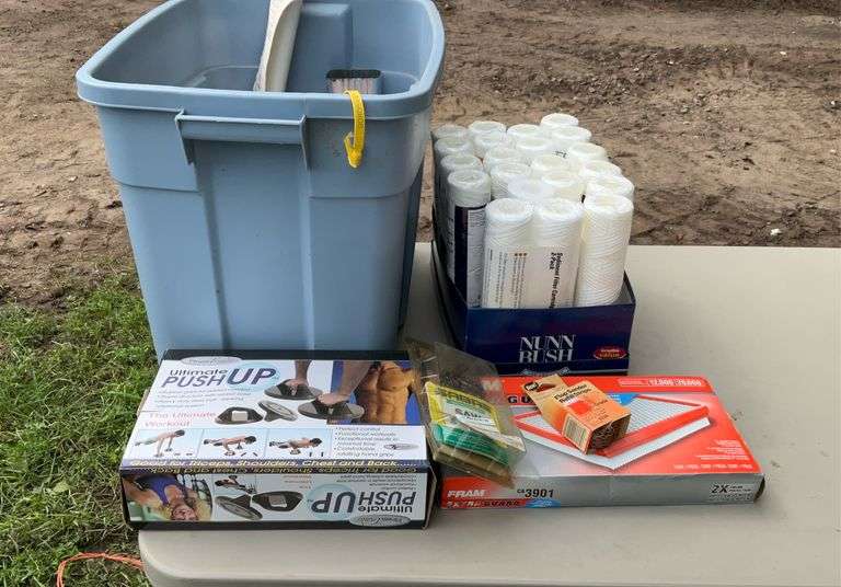 Tote of sediment filter cartridges & As seen on TV gadgets