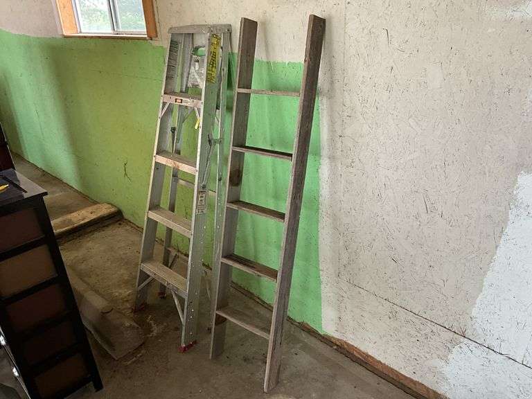 Aluminum step ladder and wood ladder