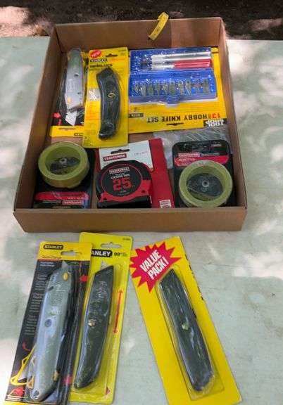 Flat of tape measures & utility knives