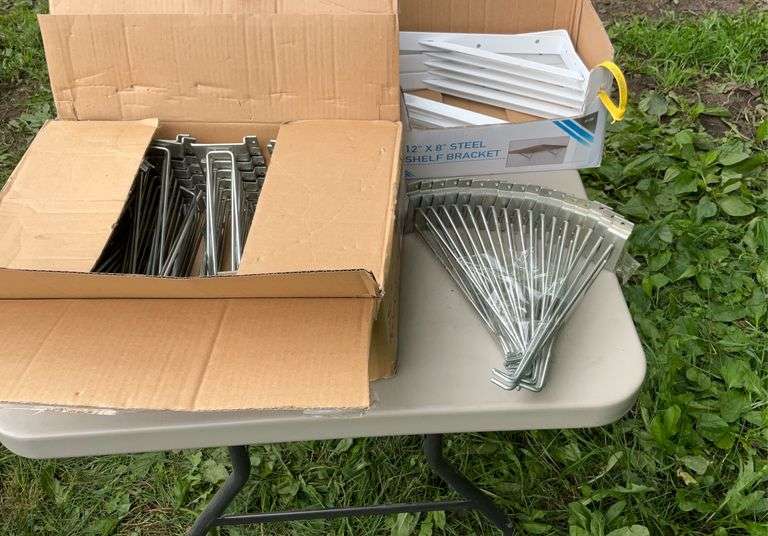 2 boxes of shelving brackets & hooks