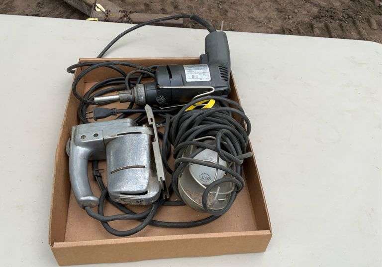 Flat of jig saw, work light, & driver