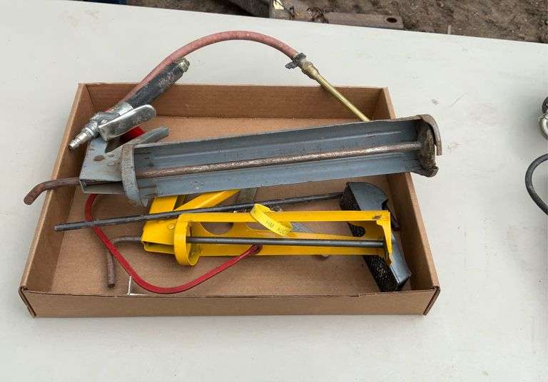 Flat with caulk guns, air chuck, hand saw