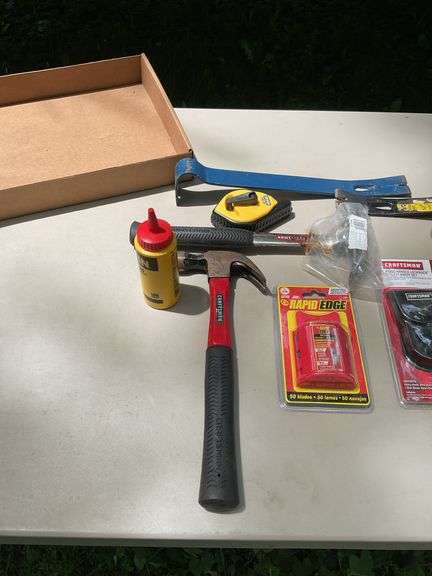 Flat of hammers, bars, tape measures, utility knives, chalk line