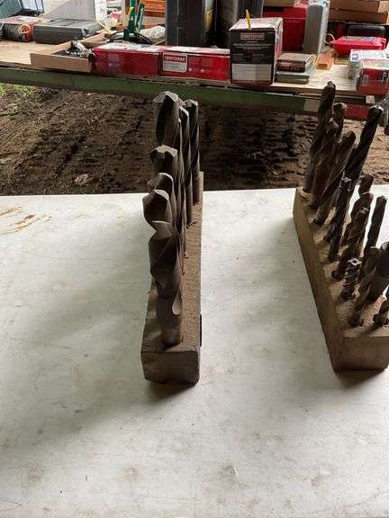 2 blocks with oversized drill bits
