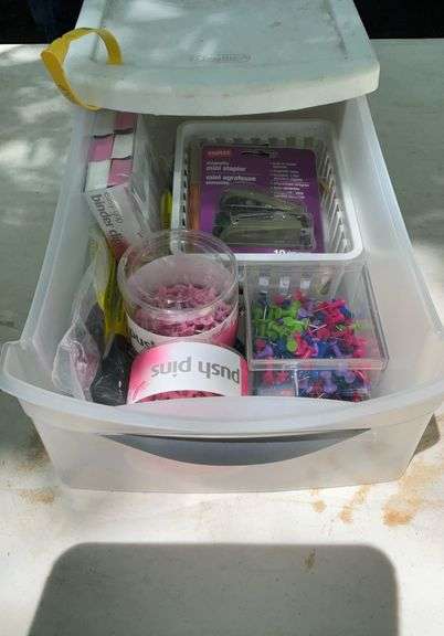 Tote of office supplies