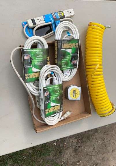 Flat of extension cords, power strips, tape measures, air hose