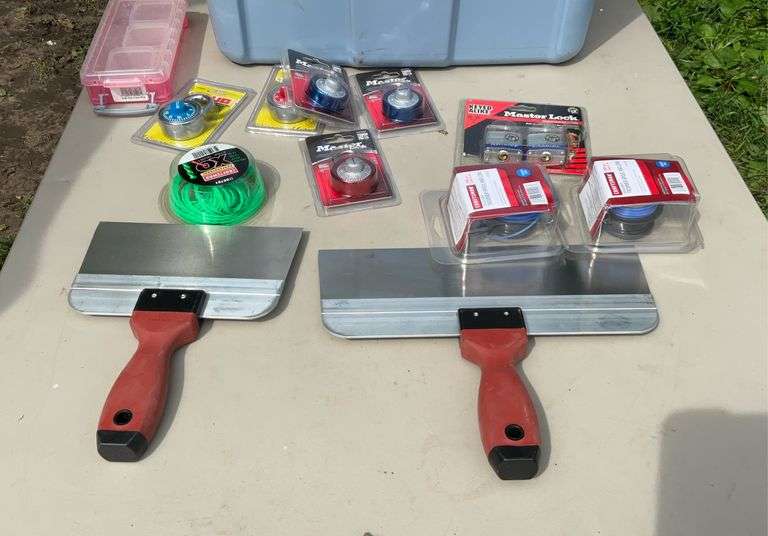 Tote of string trimmer line, pad locks, misc