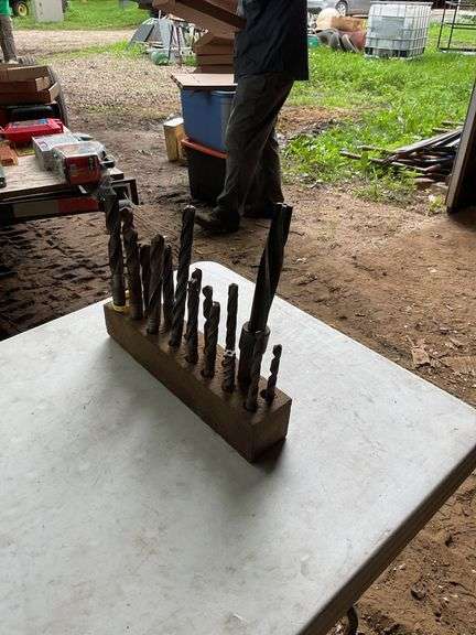 2 blocks with oversized drill bits