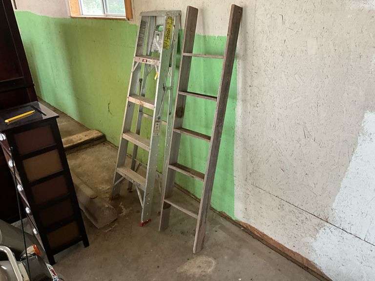 Aluminum step ladder and wood ladder