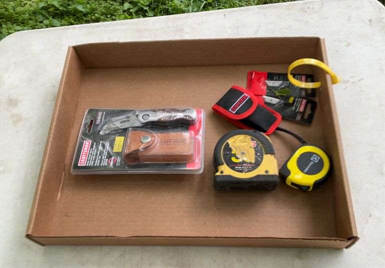 Flat of tape measures, razor blade knives
