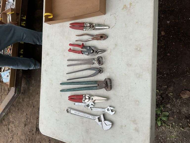 Flat of pliers, tin snips, adjustable wrenches