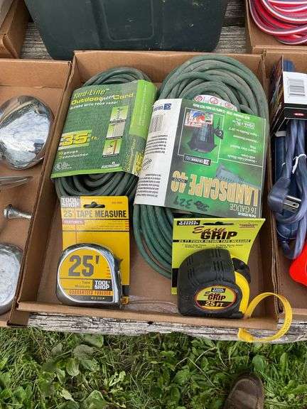 Flat of extension cords, power strips, tape measure