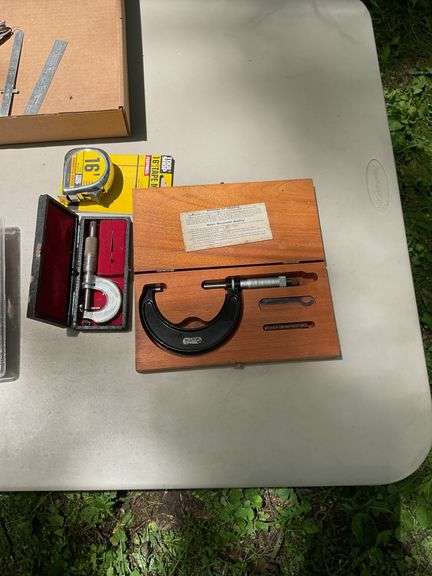 Flat of micrometers, tape measure, utility knife