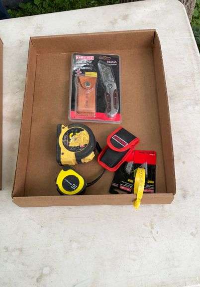 Flat of tape measures, razor blade knives