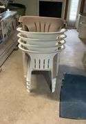 (5) stackable plastic chairs