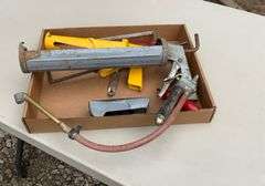 Flat with caulk guns, air chuck, hand saw