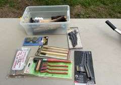 Tote of wire brushes, toggle pliers