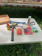 Flat of hammers, bars, tape measures, utility knives, chalk line