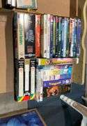 2 flats of cd's, cassettes music and VHS Tapes
