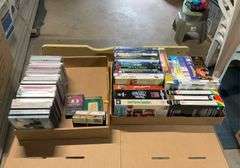 2 flats of cd's, cassettes music and VHS Tapes