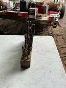 2 blocks with oversized drill bits