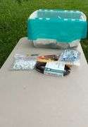 Tote of electrical supplies jig saw blades, wire staples, misc