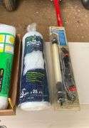 3 rolls of plastic and a work light