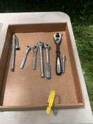 Flat of craftsman ratchets, utility knife, pliers