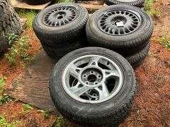 (4) 205/70r15 Tires on 5 Bolt Rims, (2) 215/55r16 Tires on 5 Bolt Rims